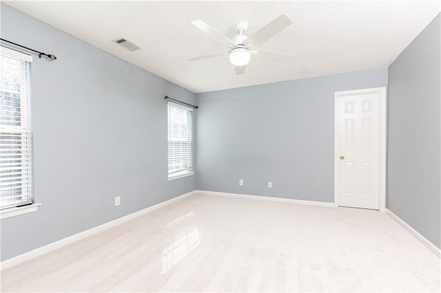 unfurnished room with ceiling fan