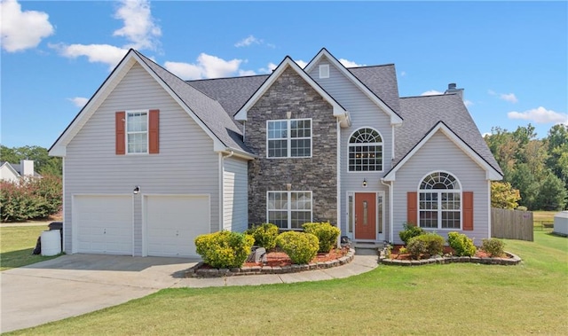 front of property with a garage and a front lawn