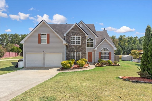 view of property with a garage and a front lawn