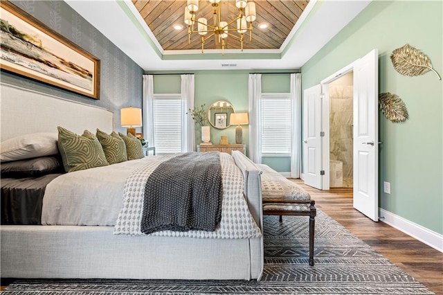 bedroom featuring crown molding, hardwood / wood-style flooring, a notable chandelier, a tray ceiling, and wooden ceiling