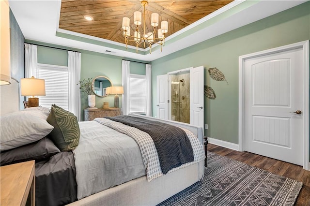 bedroom featuring wood ceiling, a tray ceiling, dark hardwood / wood-style flooring, and a chandelier