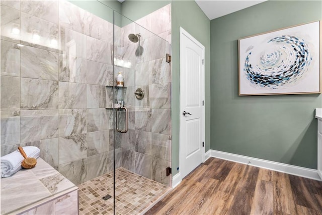 bathroom with an enclosed shower, vanity, and hardwood / wood-style flooring