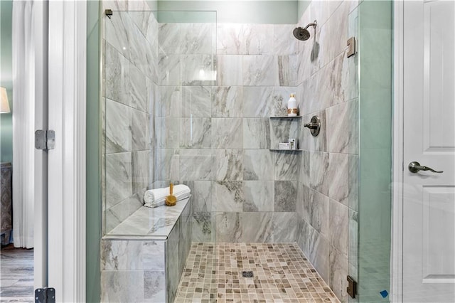 bathroom with a shower with shower door