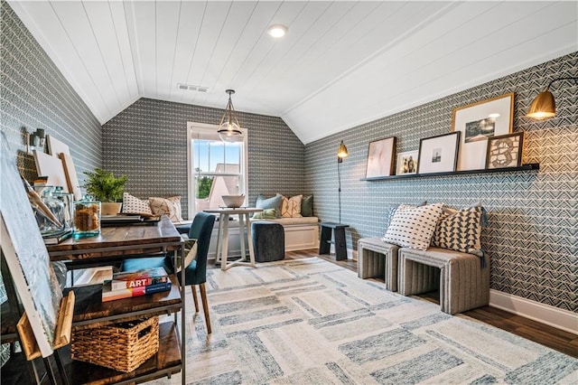 interior space featuring lofted ceiling and wood-type flooring