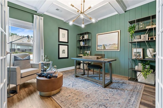 office featuring beamed ceiling, wood-type flooring, coffered ceiling, and an inviting chandelier