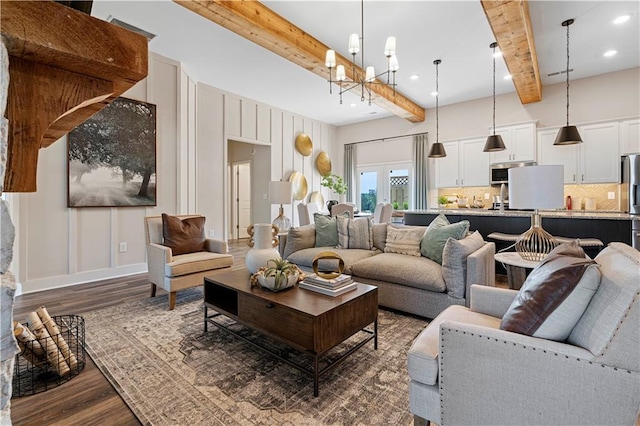 living room featuring dark hardwood / wood-style flooring, beam ceiling, and a chandelier