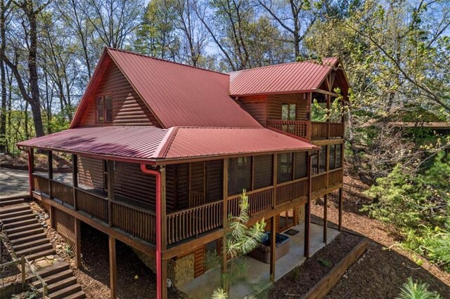 342 Zenith Trl, Ellijay, GA 30540 - exterior space with a patio area, metal roof, a sunroom, and log veneer siding