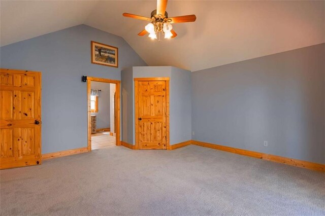 342 Zenith Trl, Ellijay, GA 30540 - unfurnished bedroom with carpet, baseboards, vaulted ceiling, and a ceiling fan