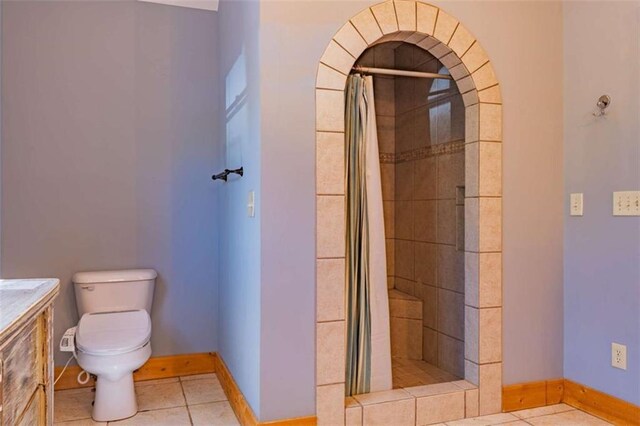342 Zenith Trl, Ellijay, GA 30540 - bathroom with toilet, tile patterned floors, baseboards, and a tile shower