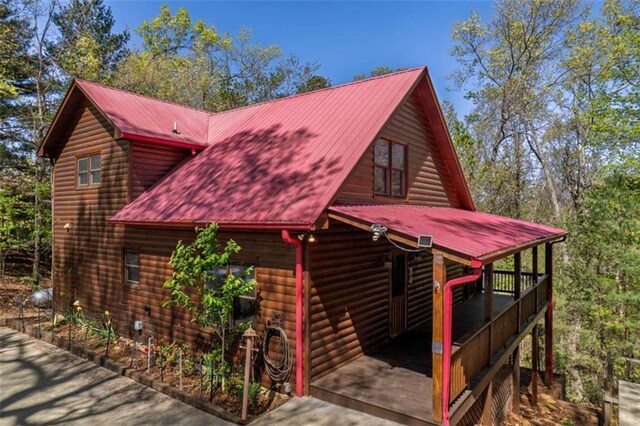 342 Zenith Trl, Ellijay, GA 30540 - view of property exterior with metal roof and faux log siding