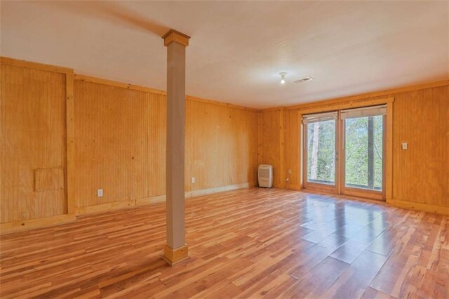 342 Zenith Trl, Ellijay, GA 30540 - spare room featuring wood finished floors, wood walls, baseboards, and visible vents