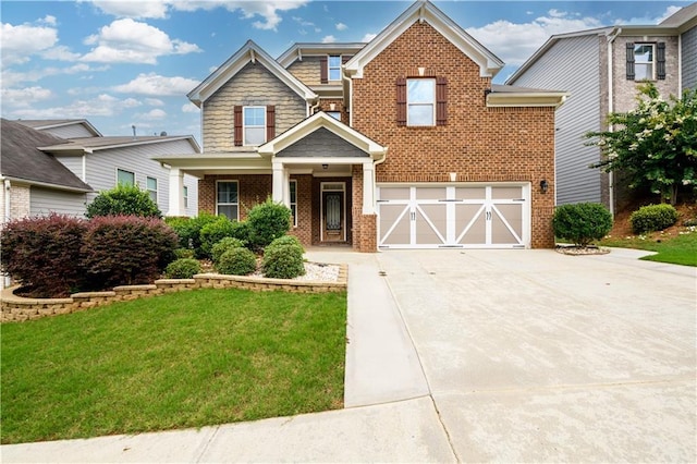 view of front of property featuring a garage and a front yard