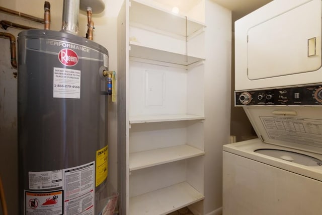 interior space featuring gas water heater, stacked washer and clothes dryer, and laundry area