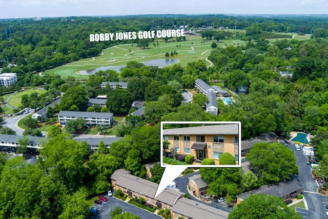 drone / aerial view featuring a water view and golf course view