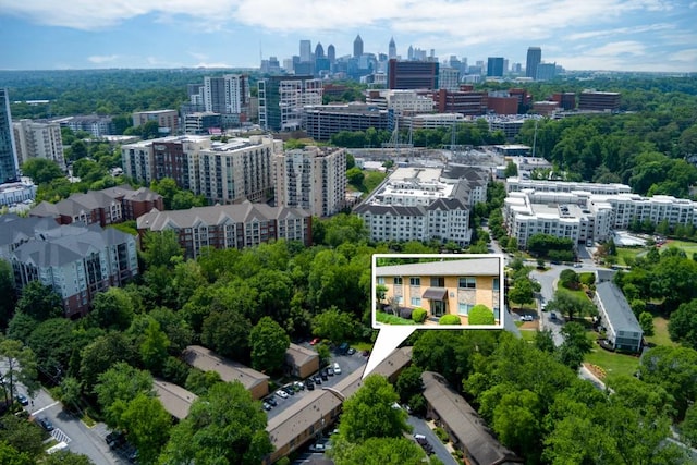 birds eye view of property featuring a view of city