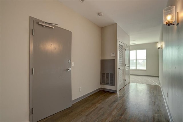 corridor featuring wood-type flooring