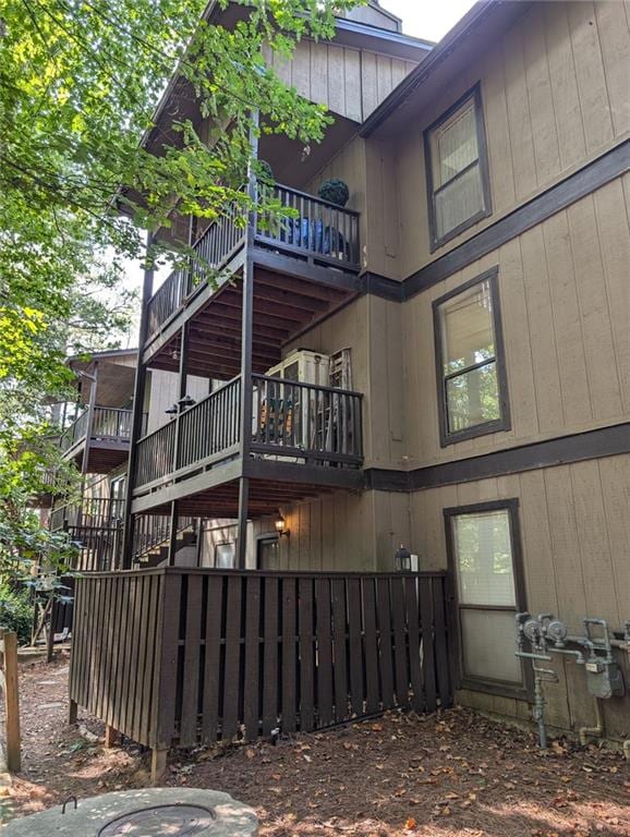 view of side of property with a balcony