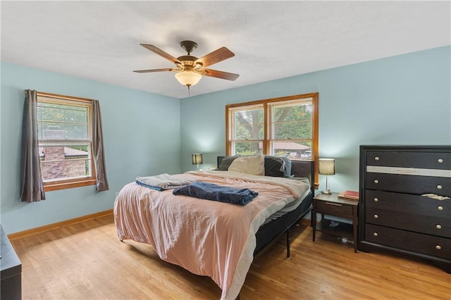 2720 Birchwood Way SW, Marietta, GA 30060 - bedroom with multiple windows, light wood finished floors, and baseboards