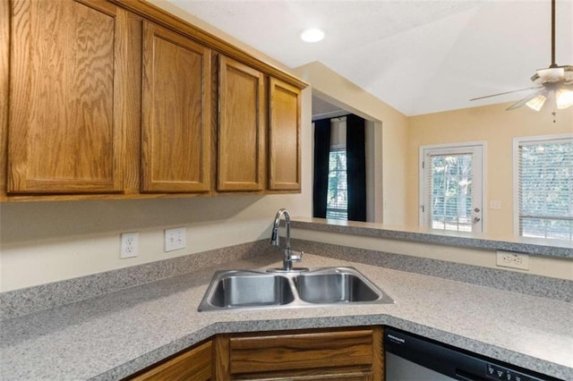 kitchen featuring dishwasher, ceiling fan, and sink