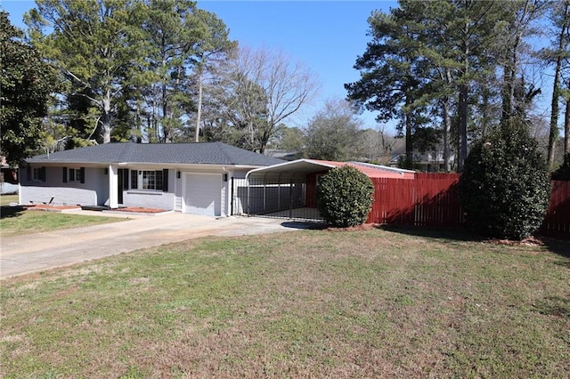 ranch-style home featuring driveway, a garage, fence, a front lawn, and a detached carport