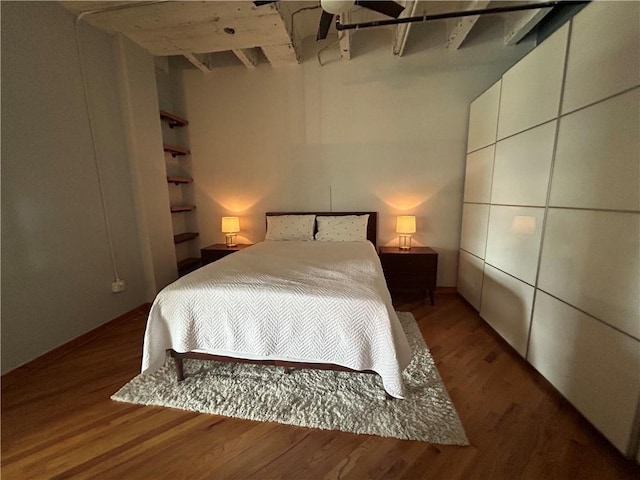 bedroom with hardwood / wood-style flooring