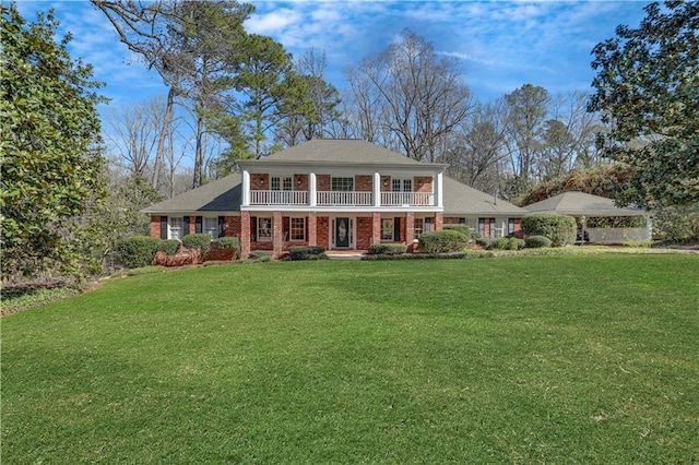 view of front of property with a porch and a front yard