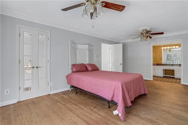 bedroom featuring ceiling fan, ensuite bathroom, crown molding, and light hardwood / wood-style floors