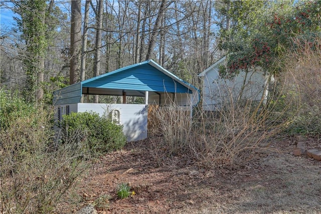 view of outbuilding featuring a carport