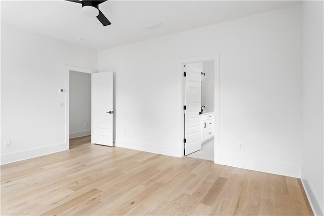 unfurnished bedroom with light wood-style floors and baseboards