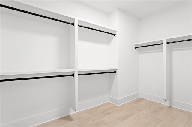 spacious closet with light wood-style floors