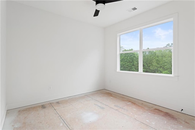 empty room with visible vents, baseboards, and ceiling fan
