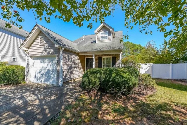 new england style home with a garage