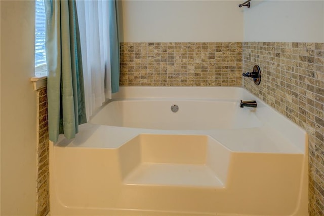 bathroom featuring a garden tub