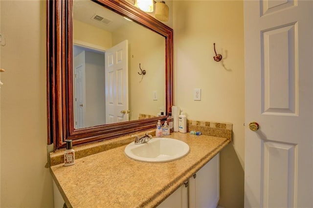 bathroom featuring visible vents and vanity