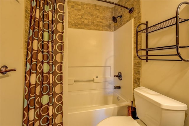 bathroom featuring shower / bathtub combination with curtain and toilet