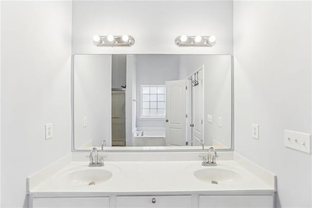 full bath with double vanity and a sink