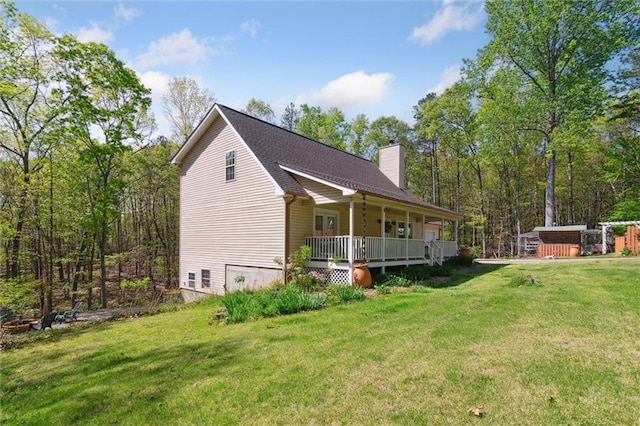 86 Sleepy Hollow Rd, Dahlonega, GA 30533 - view of side of property with a chimney, a porch, a lawn, and roof with shingles