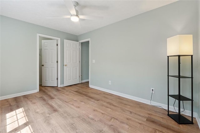 86 Sleepy Hollow Rd, Dahlonega, GA 30533 - unfurnished bedroom featuring light wood-style flooring and ceiling fan