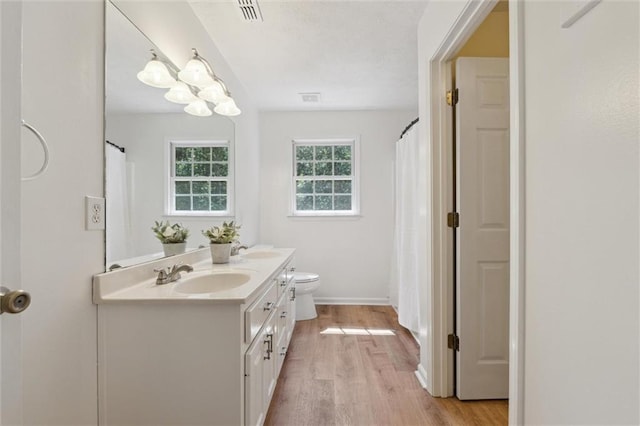 86 Sleepy Hollow Rd, Dahlonega, GA 30533 - bathroom featuring double vanity, wood finished floors, and curtained shower
