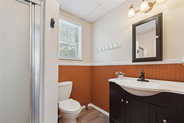 86 Sleepy Hollow Rd, Dahlonega, GA 30533 - full bathroom featuring wainscoting, vanity, wood finished floors, a drop ceiling, and a shower
