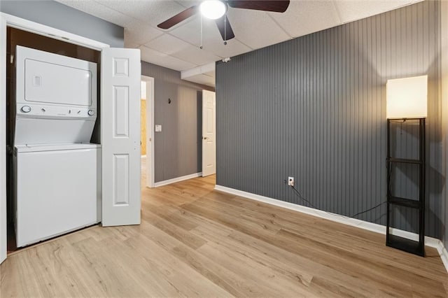 86 Sleepy Hollow Rd, Dahlonega, GA 30533 - laundry room with estacked washer and dryer, light wood-type flooring, and a ceiling fan