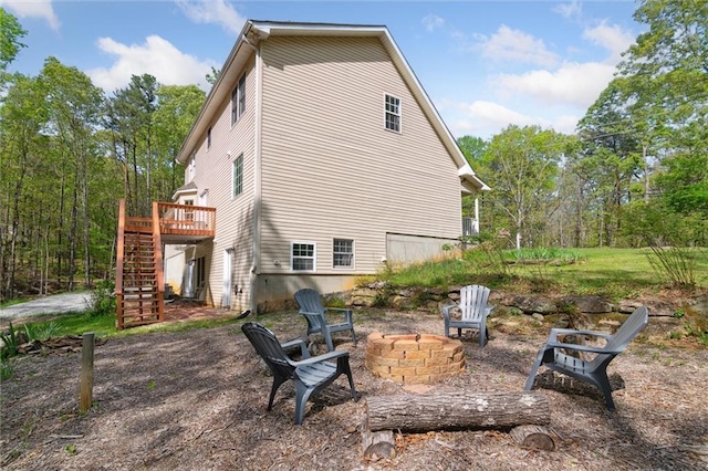 86 Sleepy Hollow Rd, Dahlonega, GA 30533 - back of property with stairway, a deck, and an outdoor fire pit
