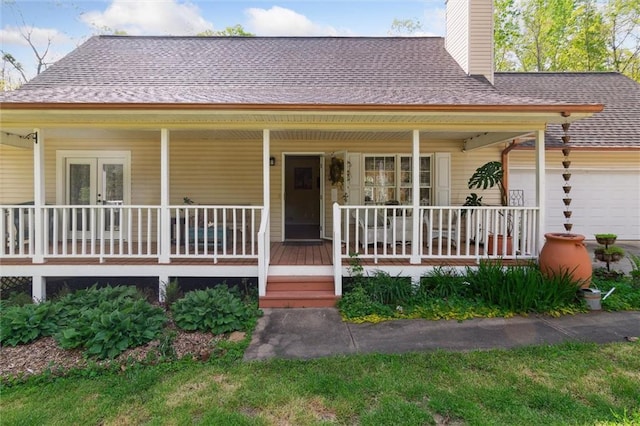 86 Sleepy Hollow Rd, Dahlonega, GA 30533 - farmhouse-style home featuring a porch, a garage, a chimney, and roof with shingles