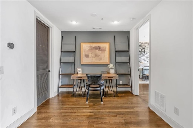 dining area featuring dark hardwood / wood-style floors