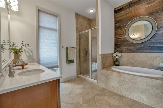 bathroom featuring tile patterned floors, vanity, and plus walk in shower