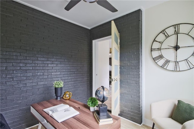 home office with brick wall