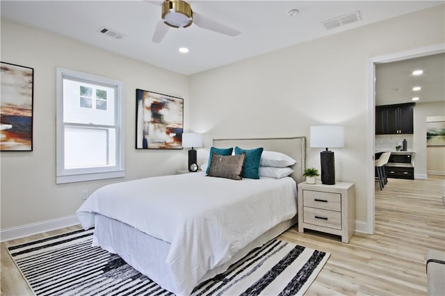 bedroom with ceiling fan and light wood-type flooring