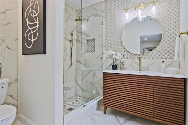 bathroom featuring vanity, toilet, and tiled shower