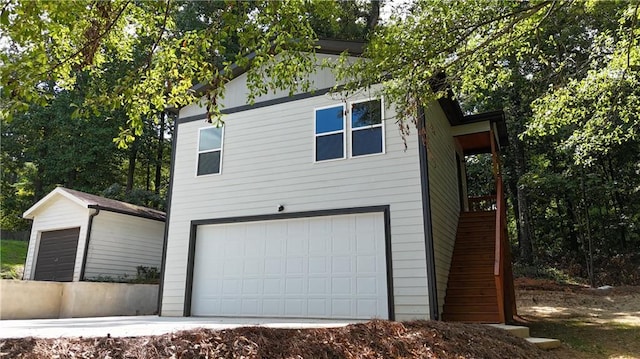 view of side of property featuring a garage