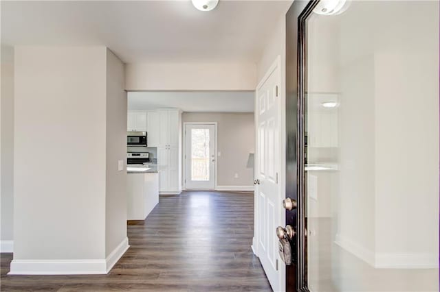 hall with dark wood-type flooring